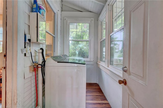 laundry area featuring plenty of natural light, dark hardwood / wood-style flooring, and washer and dryer