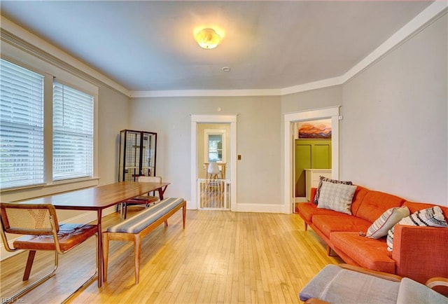 interior space featuring light wood-type flooring and crown molding