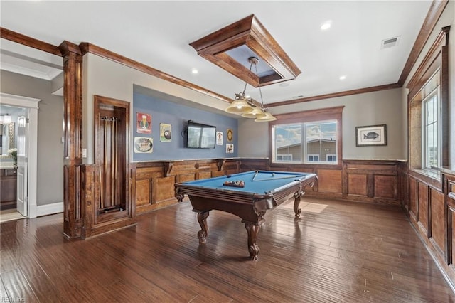 playroom with pool table, ornamental molding, and dark wood-type flooring