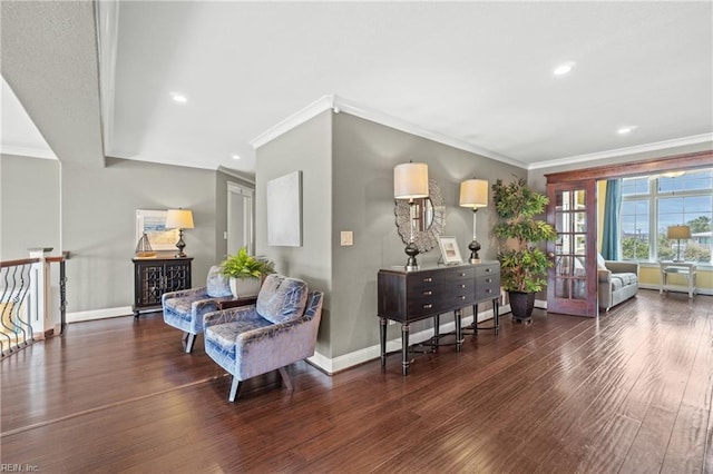 sitting room featuring dark hardwood / wood-style floors and ornamental molding