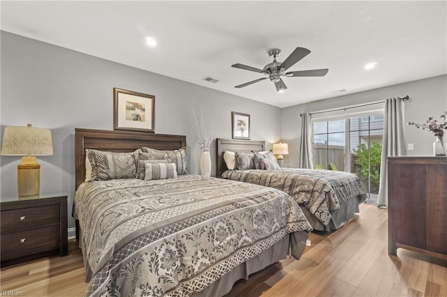 bedroom with ceiling fan, light hardwood / wood-style flooring, and access to exterior