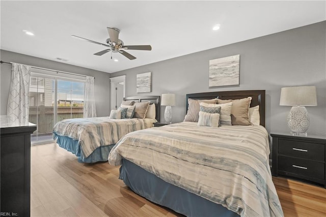 bedroom with light hardwood / wood-style floors and ceiling fan