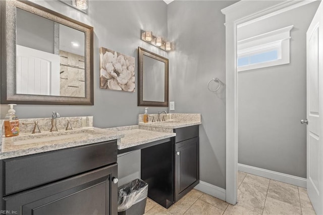 bathroom with tile patterned floors and vanity