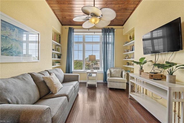 living room with wood ceiling, dark hardwood / wood-style floors, ceiling fan, and built in shelves