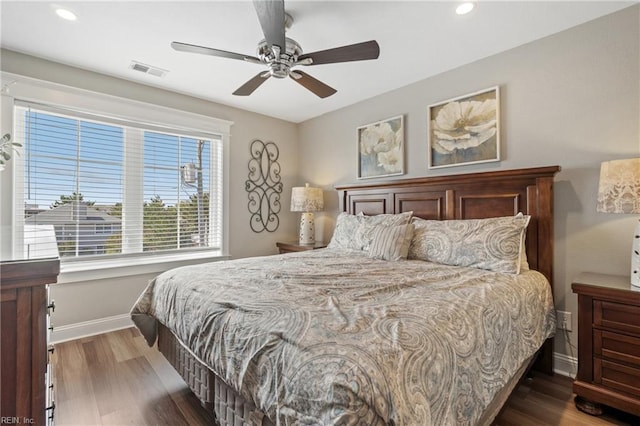 bedroom featuring dark hardwood / wood-style flooring and ceiling fan