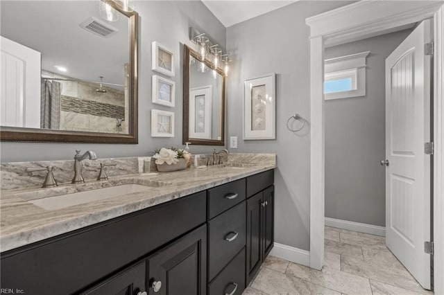 bathroom featuring vanity and a shower with shower curtain