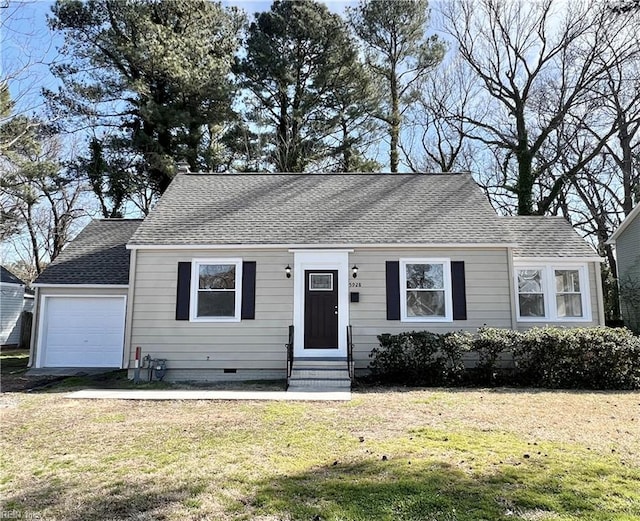 view of front facade with a front yard and a garage