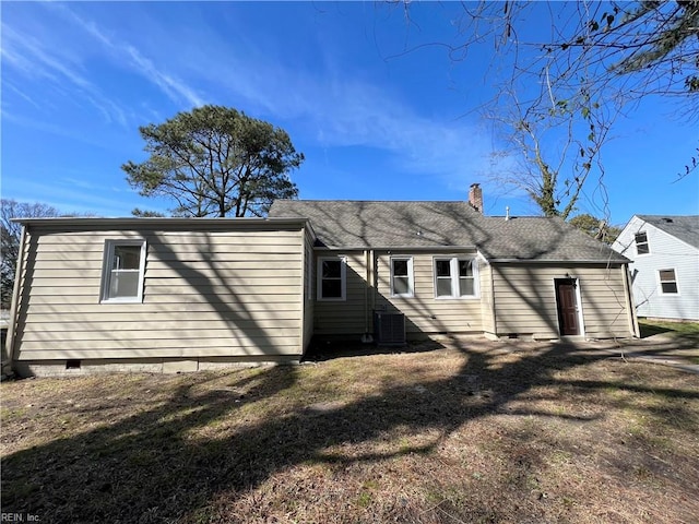 back of house featuring central AC