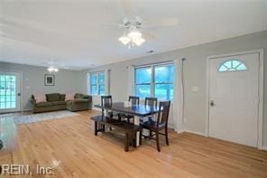 dining area featuring ceiling fan and light hardwood / wood-style flooring