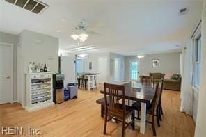 dining space with hardwood / wood-style flooring