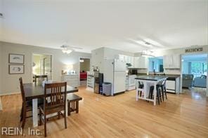 dining area with light hardwood / wood-style flooring