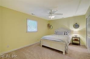 bedroom featuring ceiling fan and light carpet