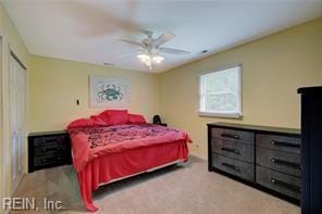 bedroom featuring ceiling fan and light carpet