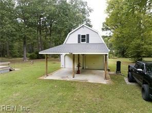 garage featuring a yard