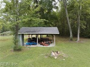 view of outdoor structure with a gazebo and a yard