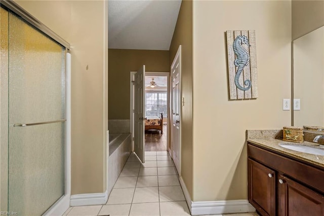 bathroom with independent shower and bath, tile patterned flooring, and vanity