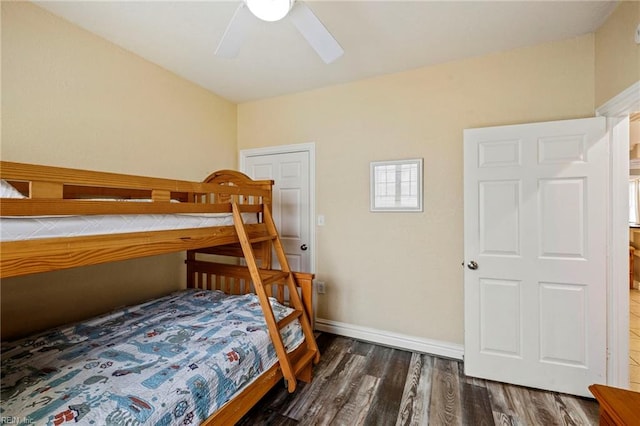 bedroom featuring ceiling fan and dark hardwood / wood-style flooring