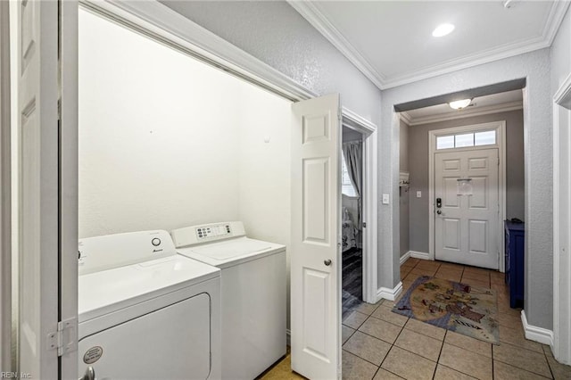 washroom with ornamental molding, light tile patterned floors, and separate washer and dryer