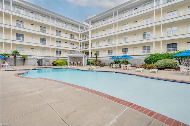 view of swimming pool with a patio