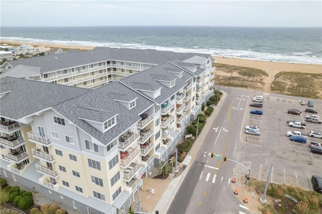 aerial view featuring a water view and a view of the beach