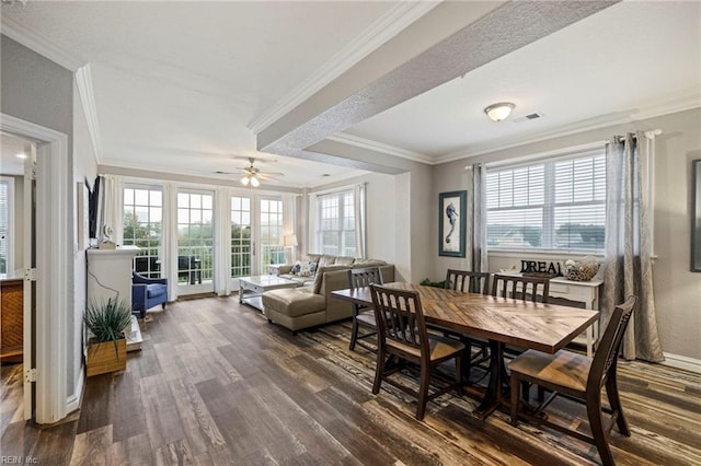 dining area featuring ornamental molding, dark wood-type flooring, and ceiling fan