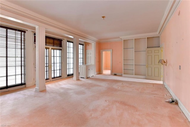 carpeted spare room with crown molding