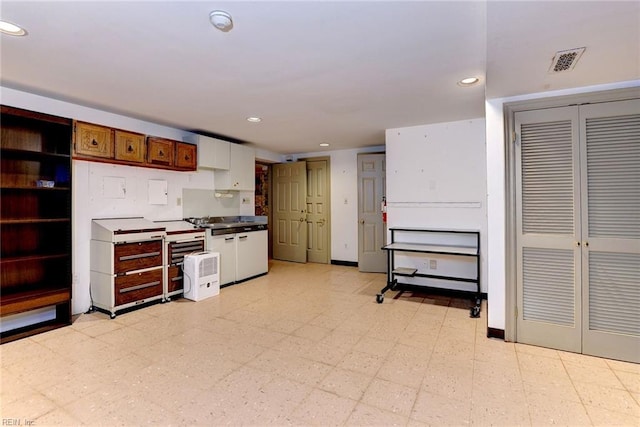 kitchen featuring white cabinetry