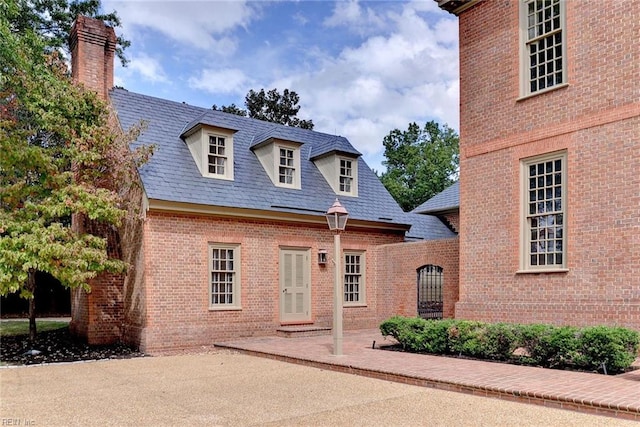 new england style home featuring a patio