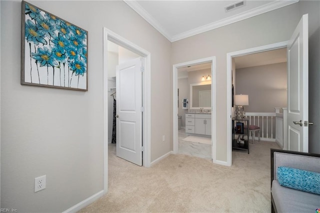 corridor featuring light carpet and crown molding