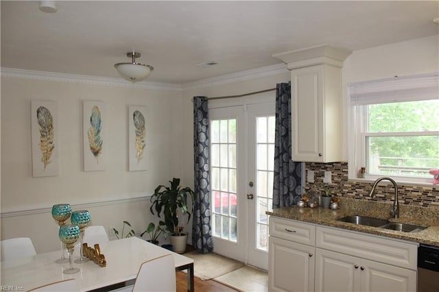 kitchen featuring light wood-type flooring, sink, white cabinets, crown molding, and light stone countertops