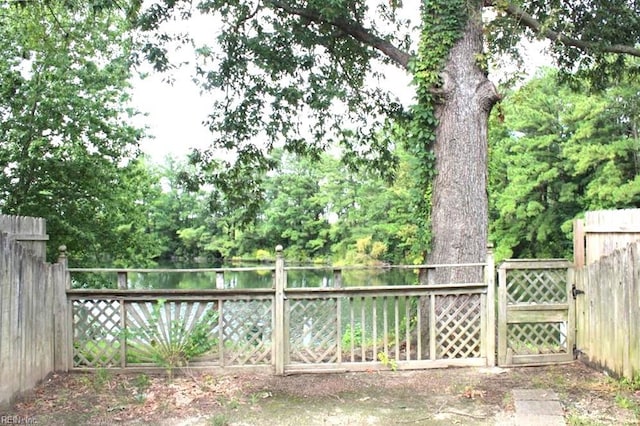 view of gate featuring a water view