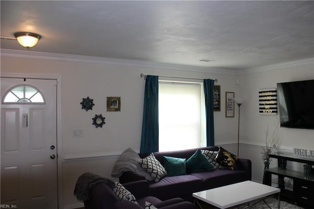 living room with ornamental molding