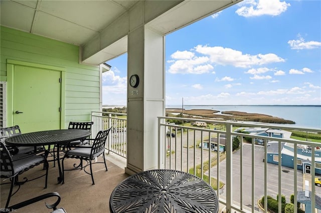 balcony featuring a water view