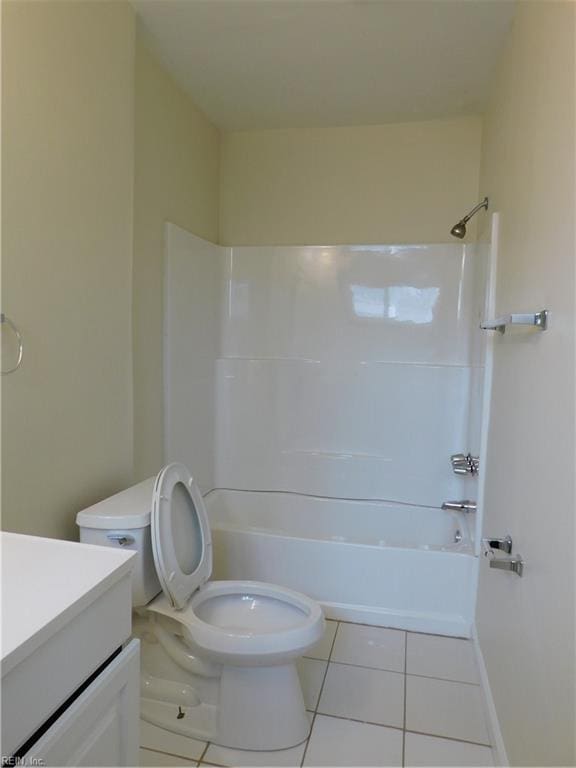 full bathroom featuring tile patterned flooring, shower / tub combination, vanity, and toilet