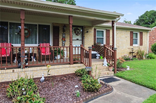 view of front of home with a front lawn and a porch