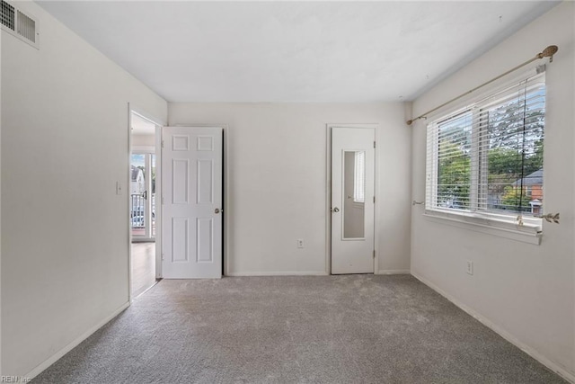 unfurnished bedroom featuring carpet