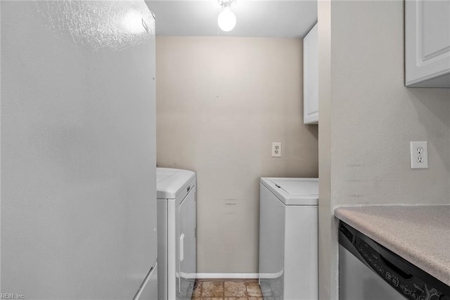 laundry area featuring washing machine and clothes dryer