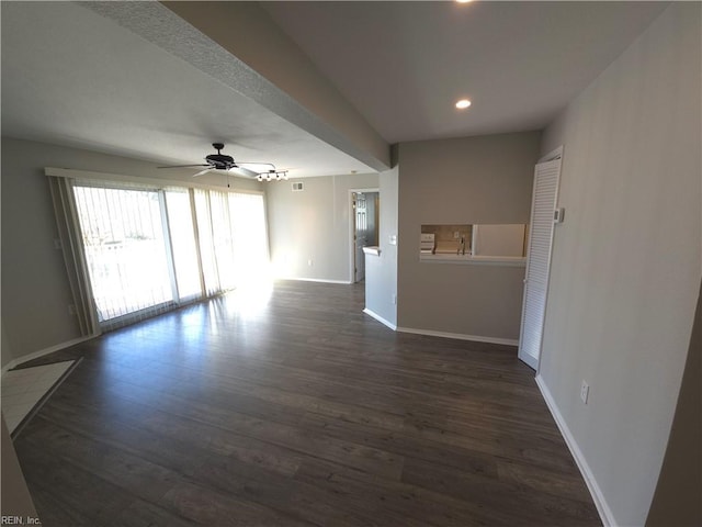 interior space featuring dark wood-type flooring and ceiling fan