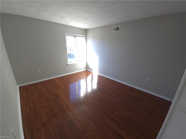 unfurnished room featuring hardwood / wood-style floors