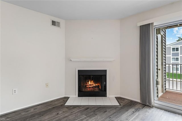 unfurnished living room featuring wood-type flooring