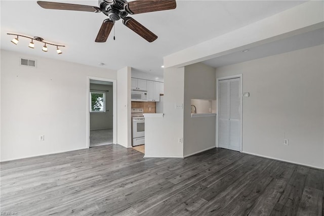 unfurnished living room featuring hardwood / wood-style floors and ceiling fan