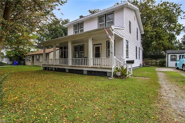 view of front of house with a front yard and a porch