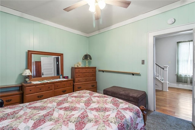 bedroom featuring ceiling fan and hardwood / wood-style floors