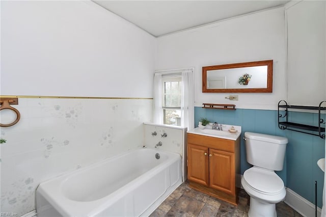 bathroom featuring vanity, a bathing tub, and toilet