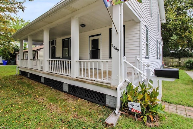 exterior space with a lawn and a porch