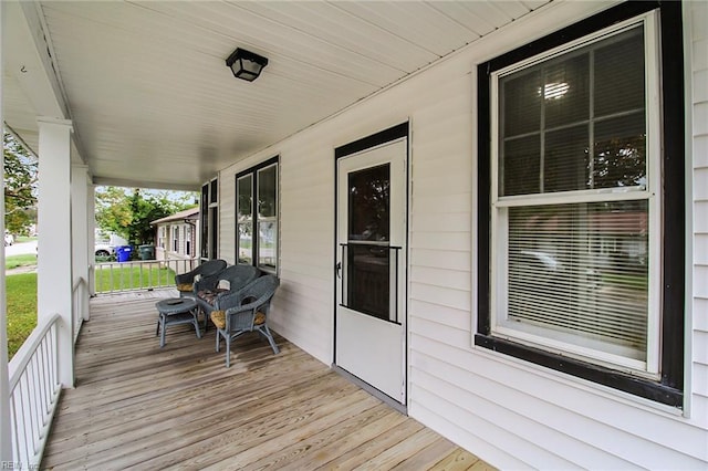 wooden deck featuring covered porch