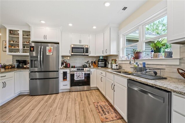 15338 Everets Rd, Windsor, VA 23487 - kitchen featuring stainless steel appliances, white cabinetry, backsplash, and recessed lighting