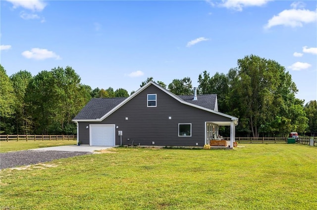 15338 Everets Rd, Windsor, VA 23487 - view of side of property with driveway, an attached garage, and a shingled roof