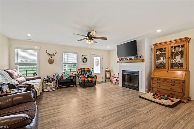 15338 Everets Rd, Windsor, VA 23487 - living room featuring ceiling fan, wood finished floors, a glass covered fireplace, and recessed lighting