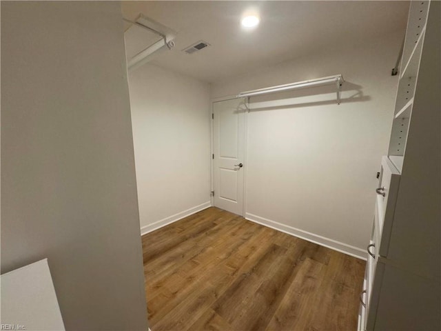 walk in closet featuring wood-type flooring